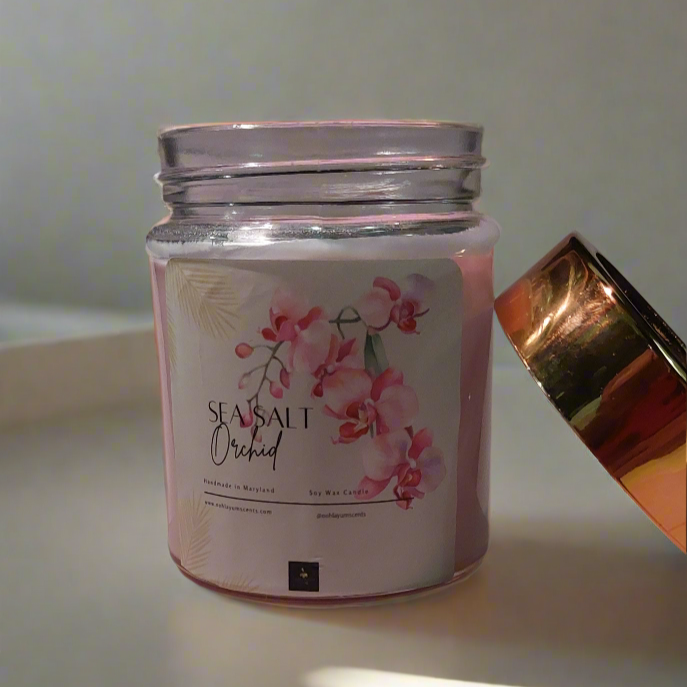Jar with a pink lid on a white surface with sunlight casting shadows