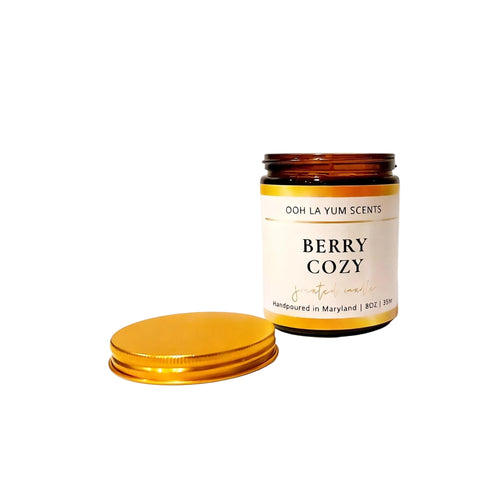 Candle jar labeled 'Berry Cozy' by Ooh La Yum Scents on a white background