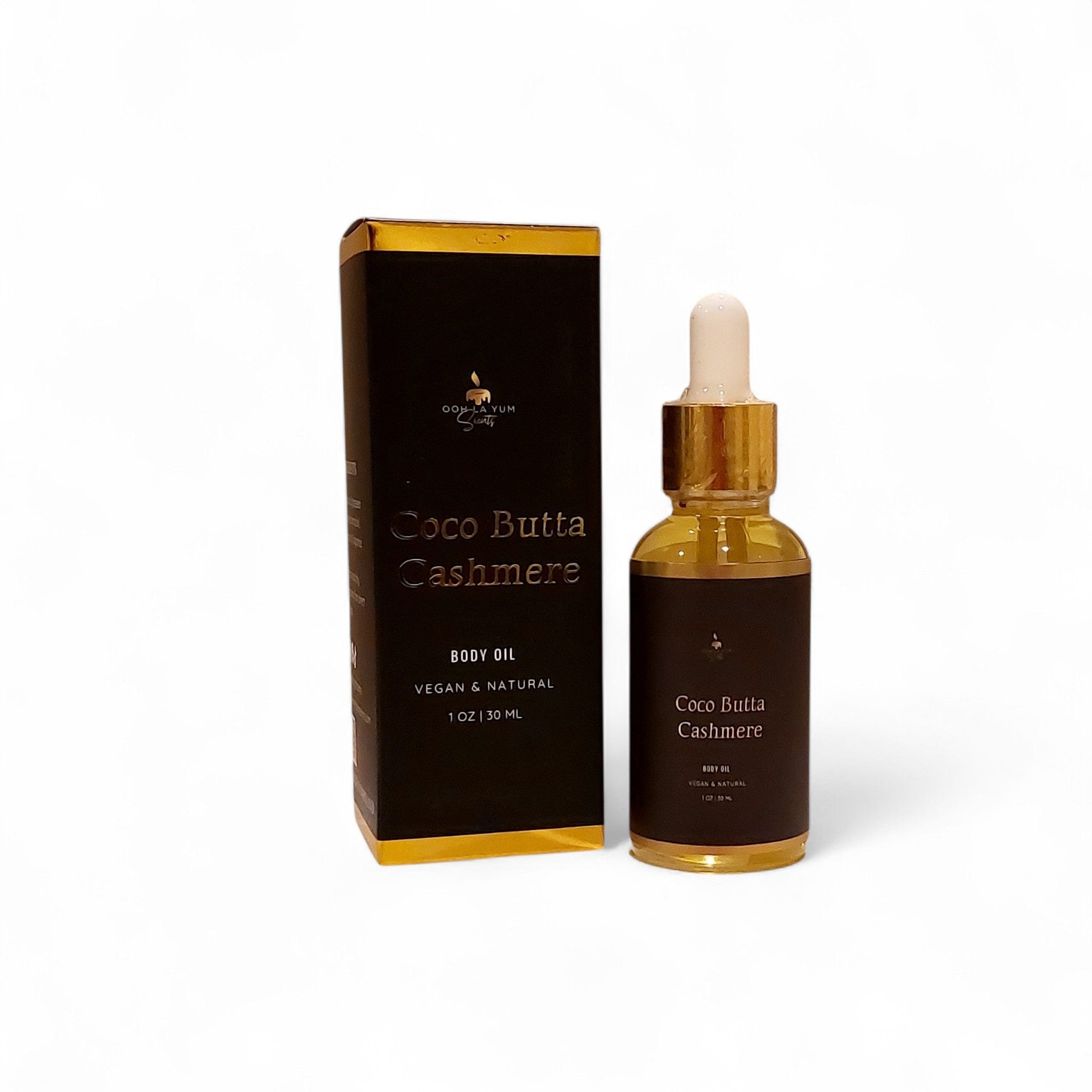 Coco Butta Cashmere body oil bottle and packaging on a white background