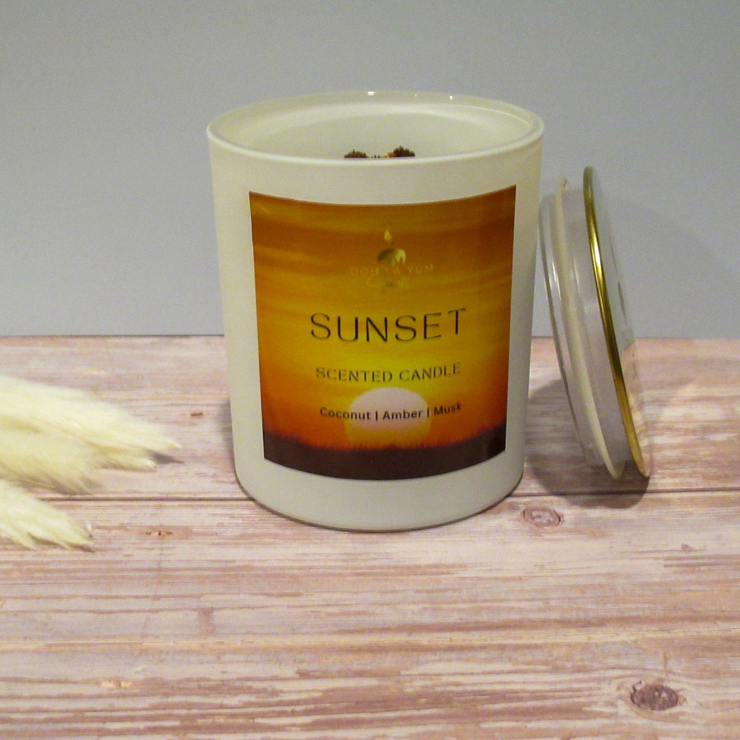 The luxury Sunset candle 15 oz white glass jar.