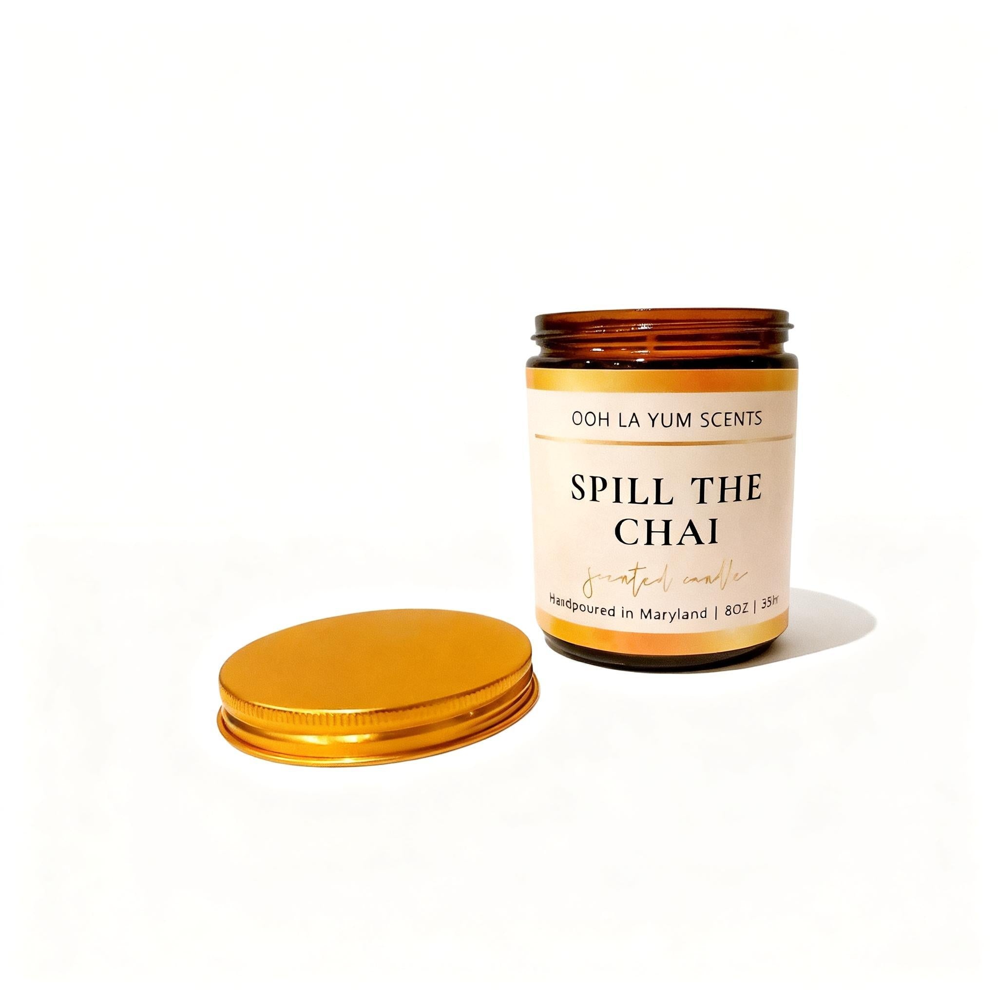 Candle jar with 'Spill the Chai' label on a white background