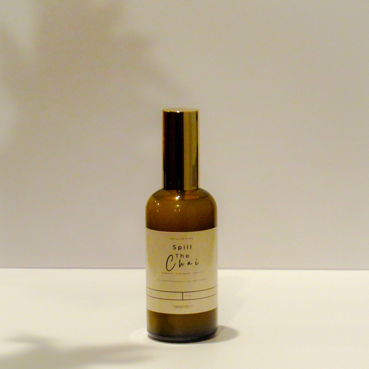 Bottle of 'Spill the Chai' on a plain background