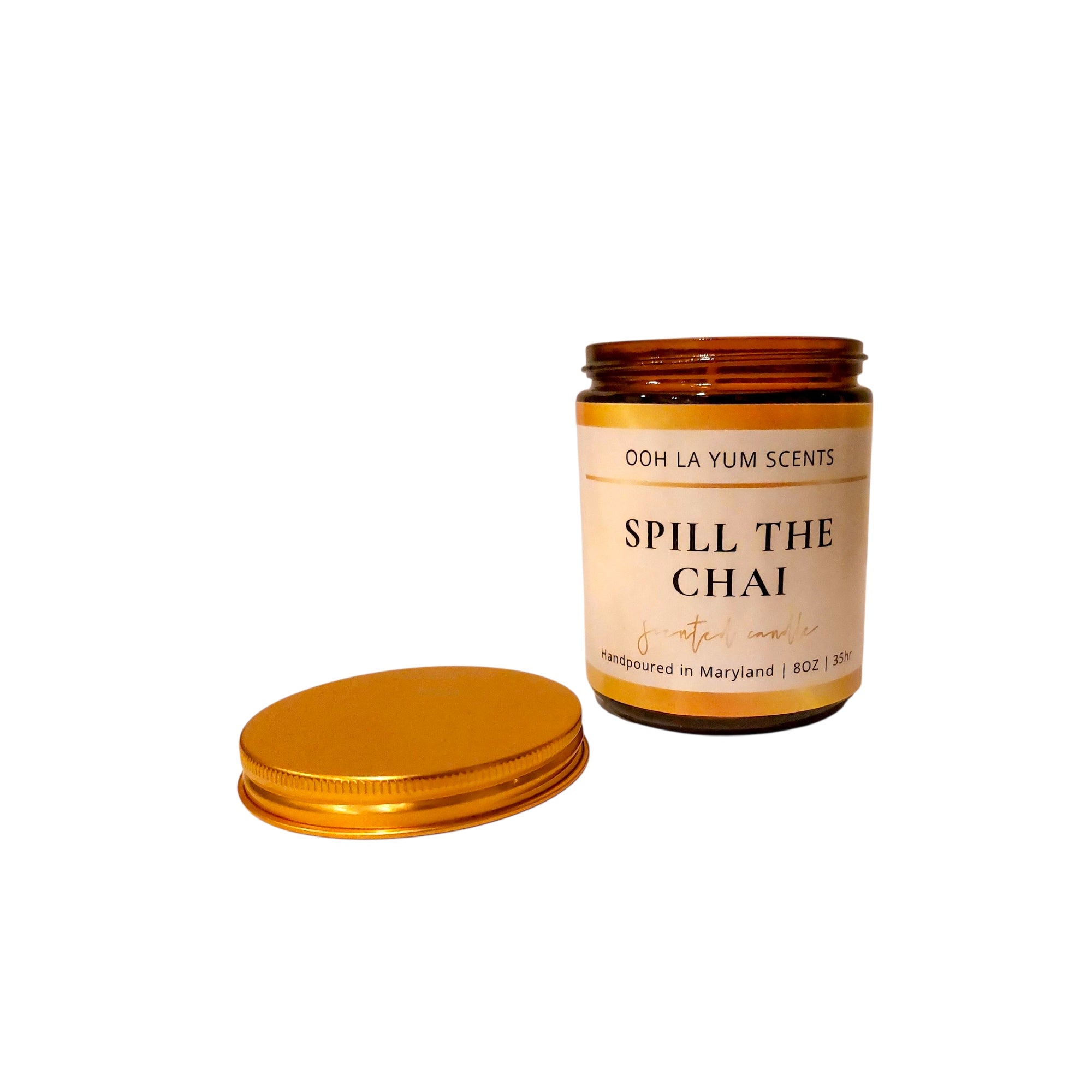 Candle jar with 'Spill the Chai' label on a white background