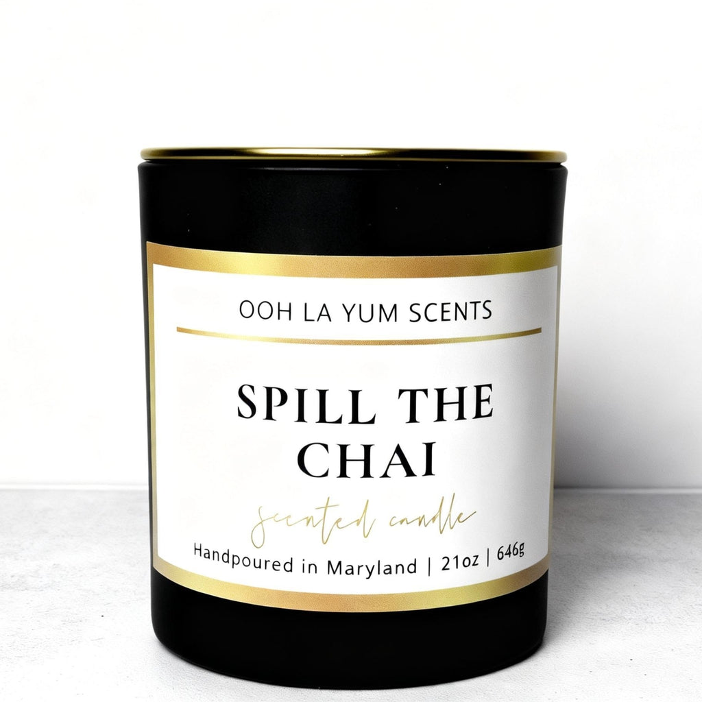 Candle with 'Spill the Chai' label on a white background