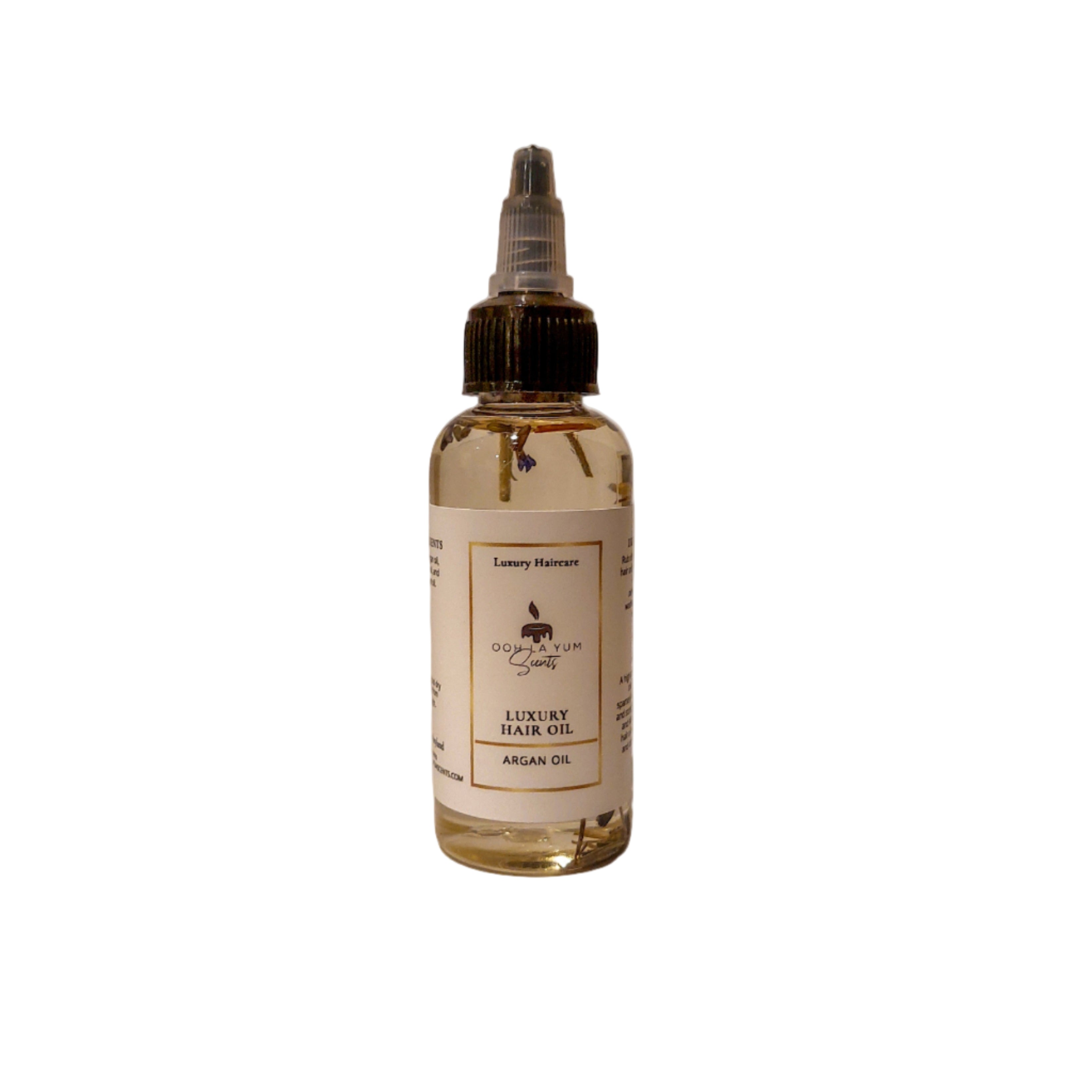 Bottle of luxury hair oil with a label on a beige background