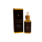 Coco Butta Cashmere body oil bottle and packaging on a white background