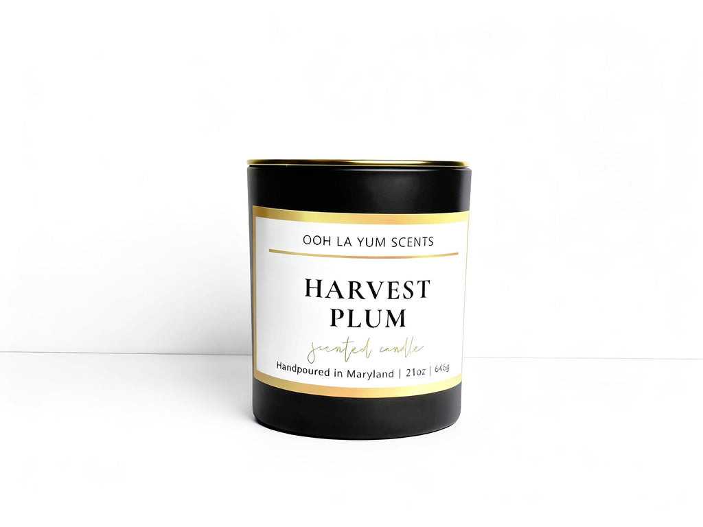 Candle labeled 'Harvest Plum' by Ooh La Yum Scents on a white background
