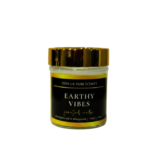 Candle jar labeled 'Earthy Vibes' by Ooh La Yum Scents on a white background