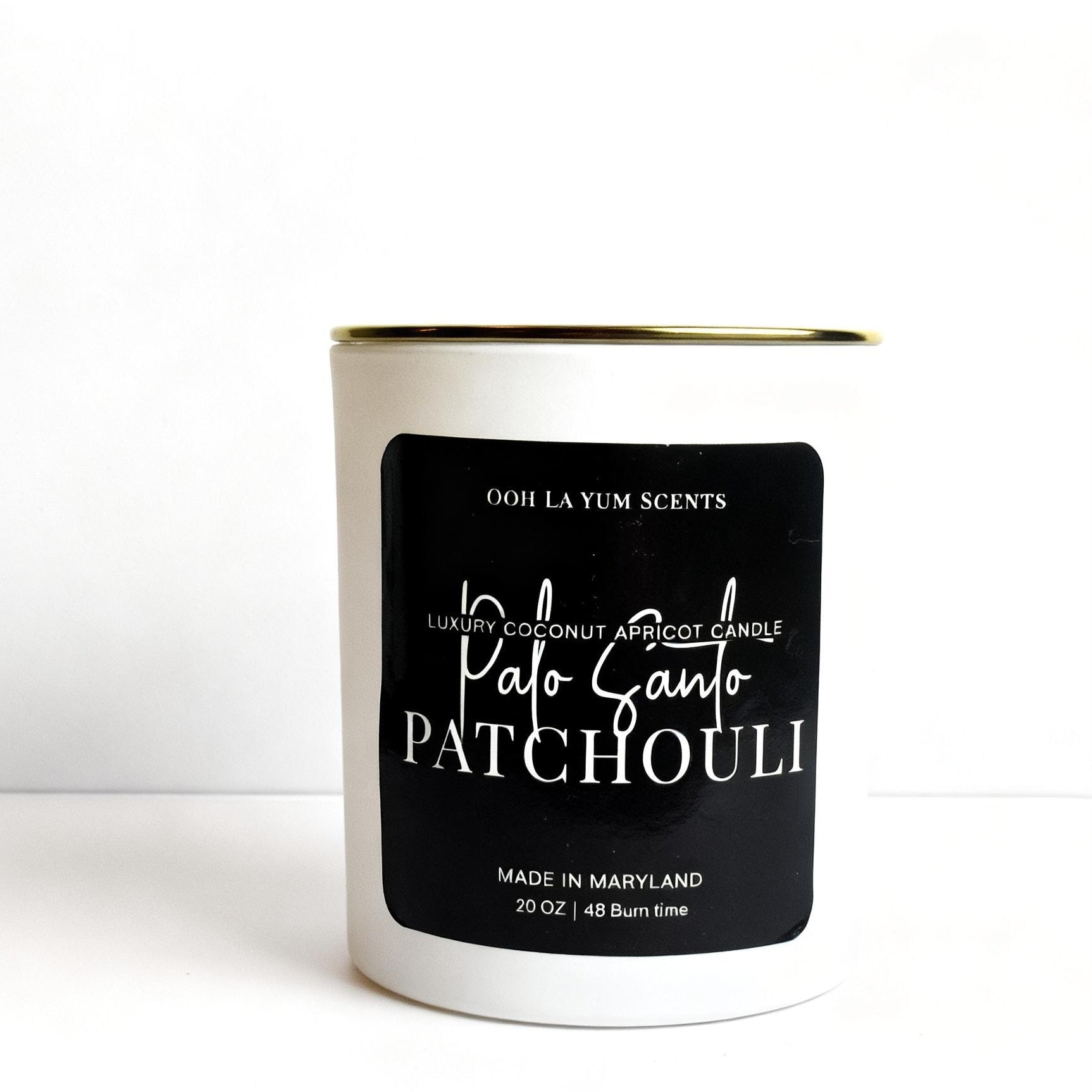 Candle with a black label on a white background