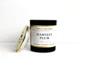 Candle labeled 'Harvest Plum' by Ooh La Yum Scents on a white background