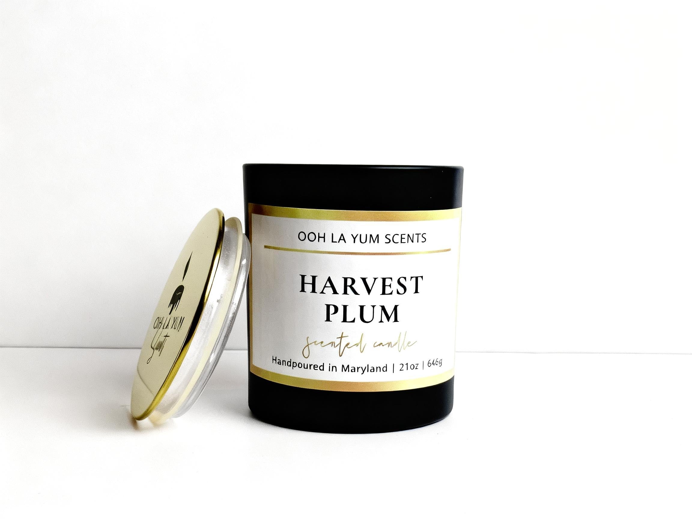 Candle labeled 'Harvest Plum' by Ooh La Yum Scents on a white background